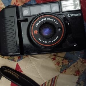 Vintage Canon 38mm camera with strap